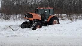 Stolen tractor found stuck in snow after police chase in northern Alberta; 1 charged