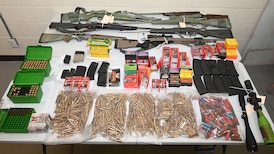 Guns, thousands of rounds of ammunition seized as a result of hit-and-run crash