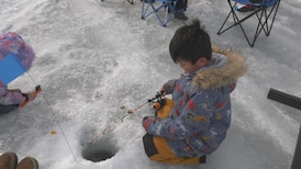 Dozens seize opportunity to try ice fishing at Wabamun Lake 