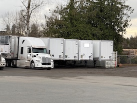 Charges laid after multi-city probe into theft of 14 semi-trailers worth over $1M, Surrey police say
