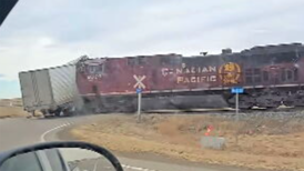 Caught on camera: Train smashes through semi-trailer in Alberta