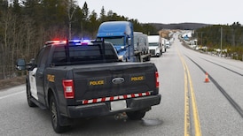 More than a dozen people charged with driving on a closed Hwy. 11