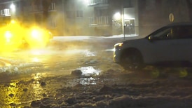 Water spills onto 97 Street from water main break in north Edmonton