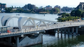 Man jumped off Johnson Street Bridge to evade arrest, Victoria police say 