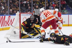 Chytil scores two, Vancouver Canucks dump Calgary Flames 5-1 in season opener